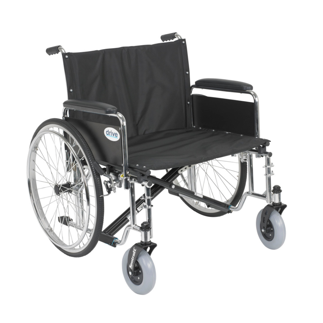 The Drive Bariatric Sentra EC Heavy-Duty Extra-Wide Wheelchair features a wide black frame, large rear wheels, small front wheels, padded armrests, metal construction, and supports up to 700 lbs for heavy-duty use.